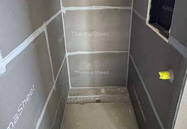Joint treatment to a Thermasheet-lined shower area